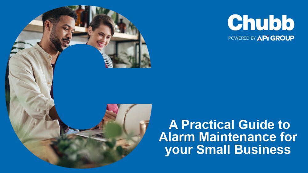 Two people work together at a laptop in a modern workspace, framed inside a large blue “C”. To the right, the Chubb and API Group logos appear above the title “A Practical Guide to Alarm Maintenance for your Small Business.